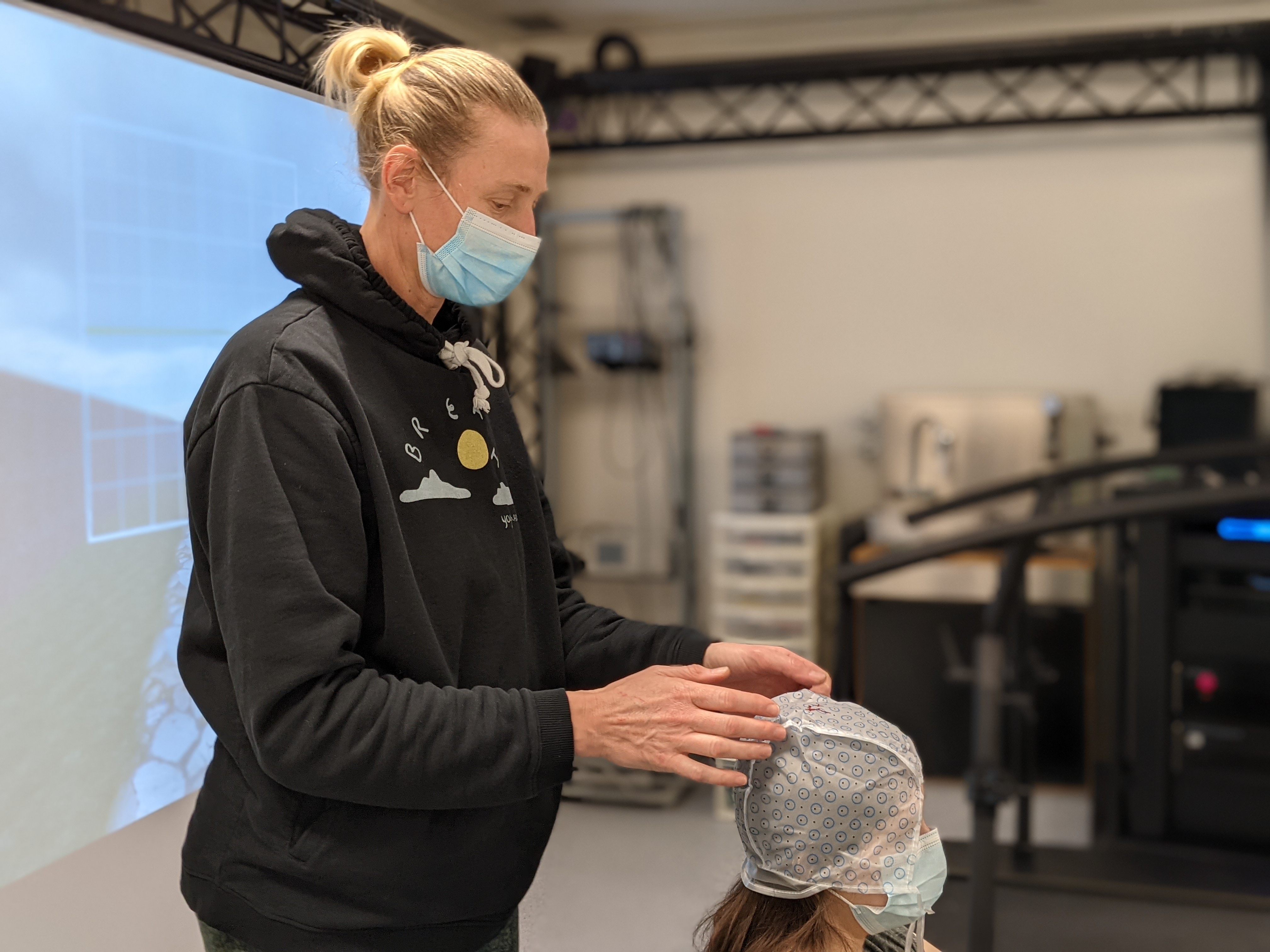 Dr. Stecina fitting EEG cap during locomotion study